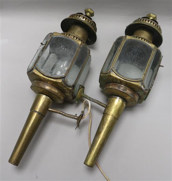 A pair of coaching lamps length 54cm